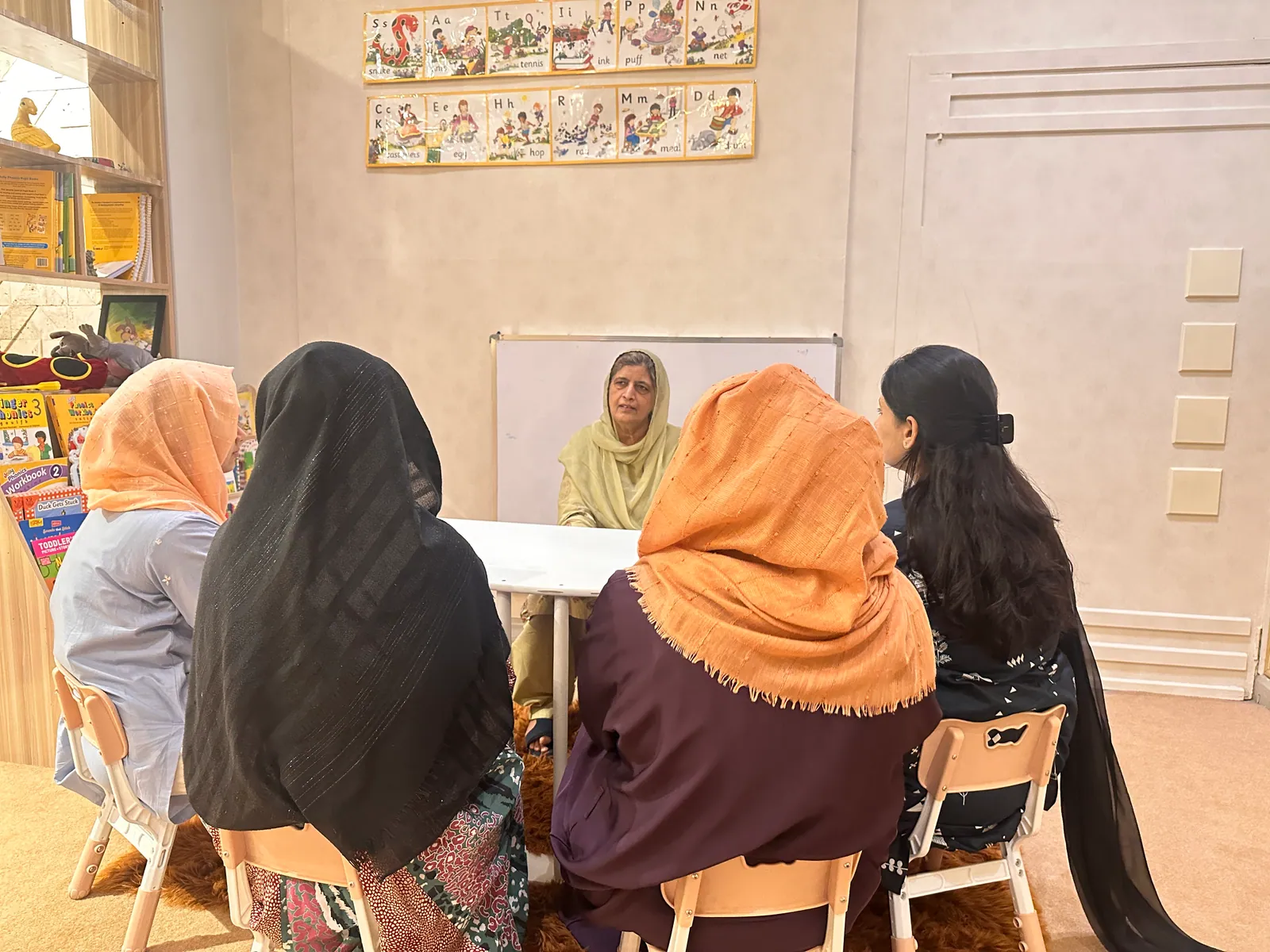 Mothers at a Mothers Club counselling session with a facilitator