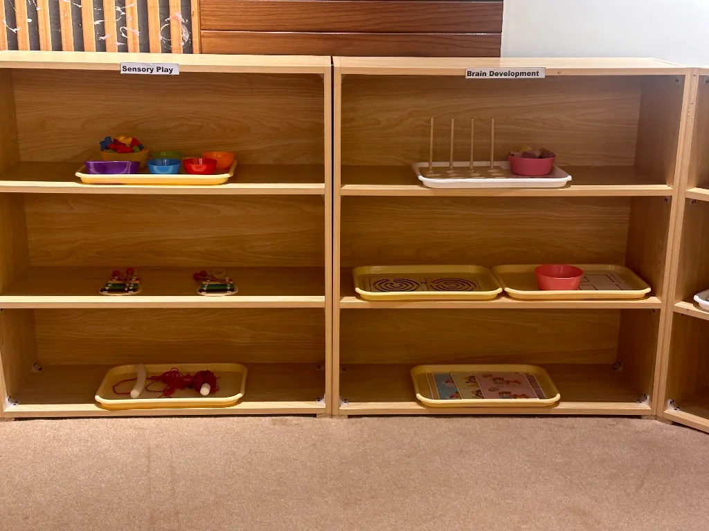 Classroom shelves of sensory play and brain development materials